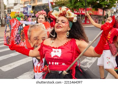 GOIANIA GOIAS BRAZIL - SEPTEMBER 28 2022: A Woman In Red Clothes Dancing In The Street. Photo Taken During A Performance In Favor Of The Presidential Candidate Of Brazil, Lula.