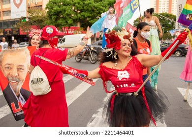 GOIANIA GOIAS BRAZIL - SEPTEMBER 28 2022: A Woman In Red Clothes Dancing In The Street. Photo Taken During A Performance In Favor Of The Presidential Candidate Of Brazil, Lula.