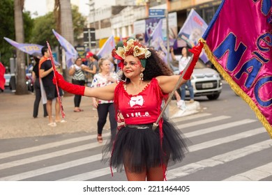 GOIANIA GOIAS BRAZIL - SEPTEMBER 28 2022: A Woman In Red Clothes Dancing In The Street. Photo Taken During A Performance In Favor Of The Presidential Candidate Of Brazil, Lula.