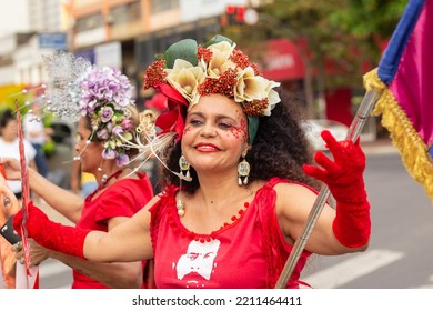 GOIANIA GOIAS BRAZIL - SEPTEMBER 28 2022: A Woman In Red Clothes Dancing In The Street. Photo Taken During A Performance In Favor Of The Presidential Candidate Of Brazil, Lula.