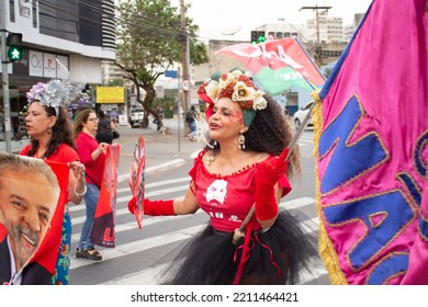 GOIANIA GOIAS BRAZIL - SEPTEMBER 28 2022: A Woman In Red Clothes Dancing In The Street. Photo Taken During A Performance In Favor Of The Presidential Candidate Of Brazil, Lula.