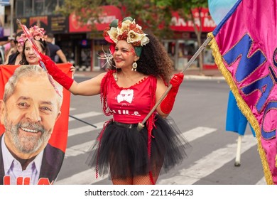 GOIANIA GOIAS BRAZIL - SEPTEMBER 28 2022: A Woman In Red Clothes Dancing In The Street. Photo Taken During A Performance In Favor Of The Presidential Candidate Of Brazil, Lula.