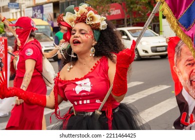 GOIANIA GOIAS BRAZIL - SEPTEMBER 28 2022: A Woman In Red Clothes Dancing In The Street. Photo Taken During A Performance In Favor Of The Presidential Candidate Of Brazil, Lula.