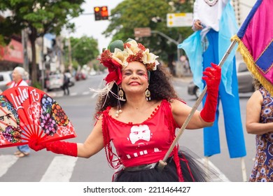 GOIANIA GOIAS BRAZIL - SEPTEMBER 28 2022: A Woman In Red Clothes Dancing In The Street. Photo Taken During A Performance In Favor Of The Presidential Candidate Of Brazil, Lula.