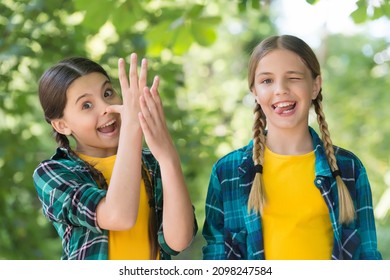 going crazy together. spend time and have fun together. best school friends. concept of friendship. small happy girls in checkered shirt. kid casual fashion. childhood happiness. happy childrens day