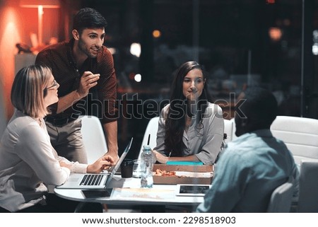 Going the extra mile makes things happen. colleagues having a meeting during a late night in a modern office.