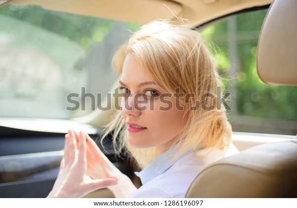 Going far away. Sexy woman enjoy road trip.\
Traveling by road transport. Pretty woman travel by automobile\
transport. Eco driving is an ecologic driving style. Eco friendly\
and sustainable travel.