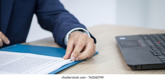 going over paperwork in office - Shutterstock ID 763560799