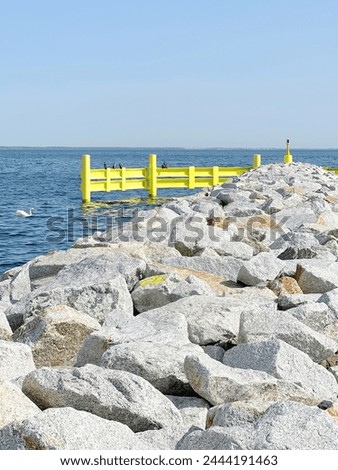 Going to rocky beaches, large stones acting as a breakwater on a beach in Europe, preventing floods, large gray boulders by the water Coastal environment, Seashore, Coastal geology, Rocky shore, Coast