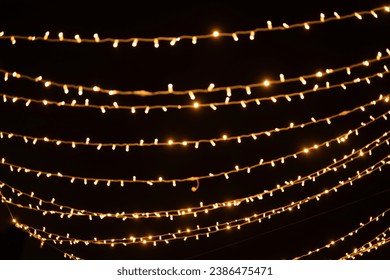 Gold abstract christmas bokeh on black background - Powered by Shutterstock