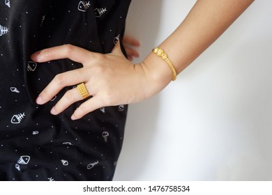 gold accessories or Gold jewelry such as necklaces, rings and bracelets on body of woman Which is beautiful when on a woman's body