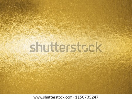 Gold background metallic golden foil texture or shinny wrapping paper bright yellow wall paper for design decoration element
