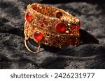 gold bangle with ruby is a stunning piece of jewelry that exudes elegance and sophistication. Crafted with exquisite attention to detail, this bangle combines the timeless allure of gold with the capt