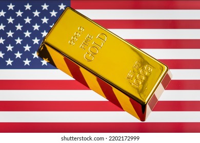 The gold bar is on the national flag of USA, united states Gold Reserve concept - Shutterstock ID 2202172999