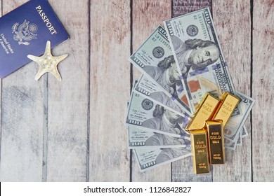 Gold Bar,passport,bank Note For The Time Of Relaxation And Tourism,Overhead View Of Traveler's Accessories,Time Of Award Of Work. Travel Concept Background. Have A Space For Text.