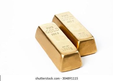 Gold Bars Against White Background