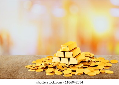 Gold Bars And Coins On Background