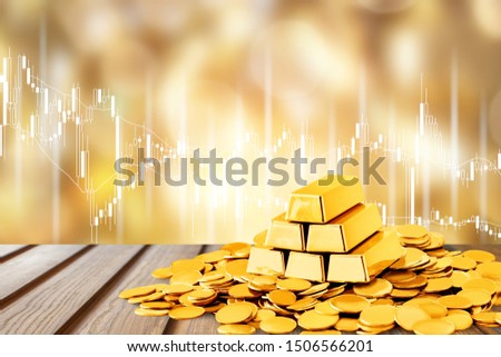 Gold bars and coins on backgrouund