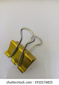 Gold Binder Clip On White Background