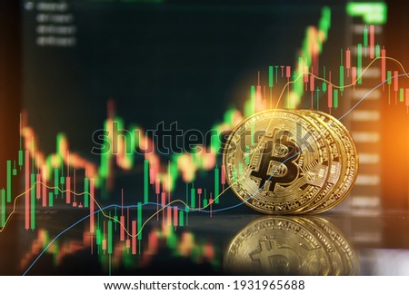Gold bitcoin with growth graph chart trading view. Bitcoin gold coin and defocused chart background. Virtual cryptocurrency concept. Stock Market chart. Bitcoin Investment Business Internet Technology