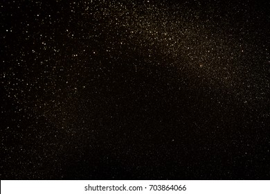 Gold And Black Glitter Vintage Lights Background. Defocused.