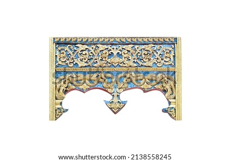 Gold blue gable temple stucco decorative on wood entrance arches with serpent king statue (naga)  and flower branch isolated on white background , clipping path	
