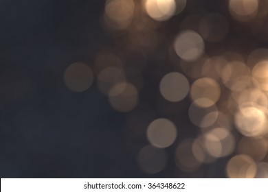 Gold Bokeh On Dark Background