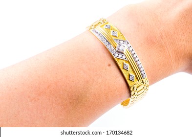 Gold Bracelet Holding Hand On Isolated White Background