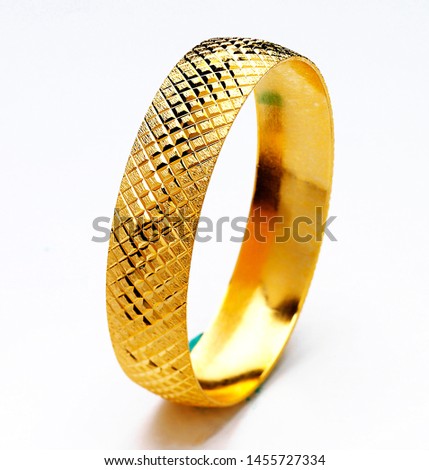 Gold bracelets isolated on white background