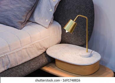 Gold Brass Lamp On Bedside Table Decor In The Interior.