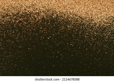 Gold and bronze glitter color confetti dots splash on black. Abstract glow shiny background.  - Powered by Shutterstock