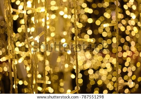 Gold bukeh shine by series wired light blub decorating for celabrate the night of Xmas