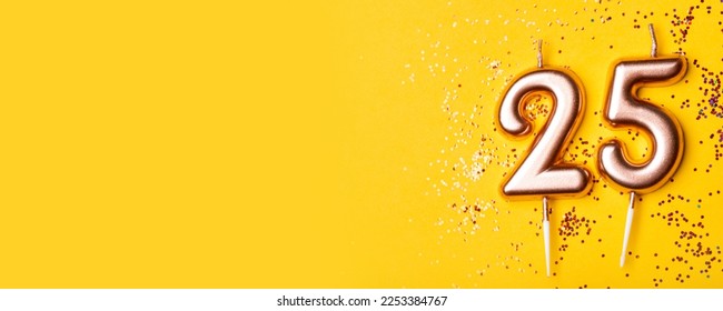 Gold candles in the form of number twenty five on yellow background with confetti. 25 years anniversary celebration. - Shutterstock ID 2253384767