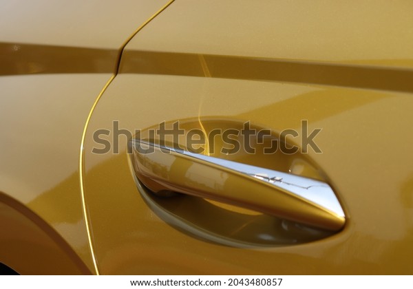 Gold car door handle\
modern