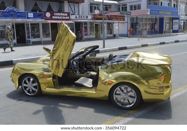Gold\
car on the streets of Anapa, Russia, June 27,\
2015