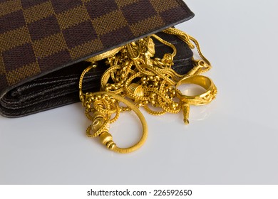 Gold Chain Handbags On White Background