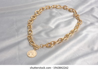 Gold Chain Necklace With A Gold Coin Clasp