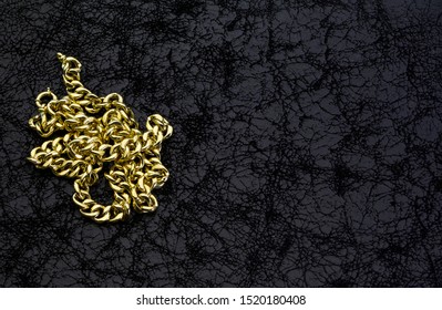 Gold Chain On Black Backgorund