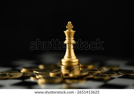 Gold chess king on a stack of coins. Business strategy concept for financial success, investment planning, wealth management, and achieving profit goals. Leadership in finance.