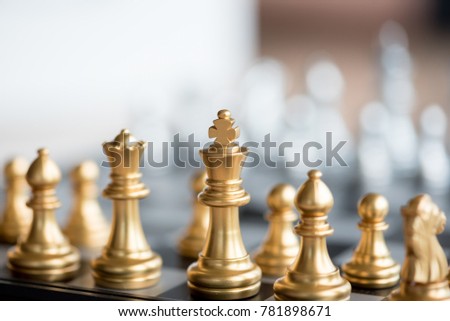 gold chess pieces on chessboard stock photo edit now 781898671