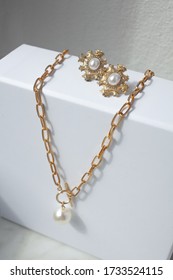 Gold Chunky Chain Necklace And Earrings With Pearls On White Background - Minimal Geometric Jewellery, Trending 