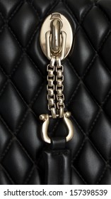 Gold Clasp On A Black Leather Background