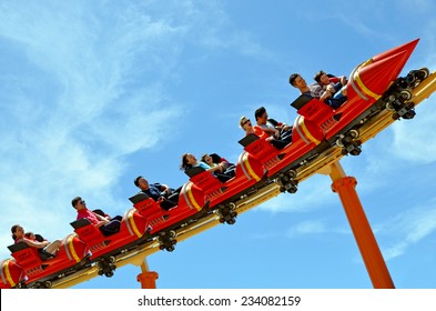 GOLD COAST, AUS -  NOV 06 2014:Visitors Ride On Road Runner Roller Coaster In Movie World Gold Coast Australia.It's A 335-metre (1,099 Ft) Junior Coaster Reaches A Top Speed Of 45.9 Km/h (28.5 Mph)