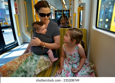 GOLD COAST, AUS - NOV 14 2014:Family Travel On Gold Coast Light Rail G In Surfers Paradise In Gold Coast Queensland, Australia.The Line Opened On July 2014 And It 13 Km (8.1 Mi) Long.