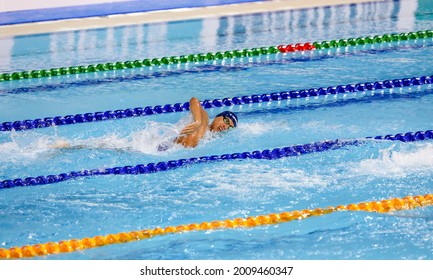 GOLD COAST, AUSTRALIA - APRIL 10, 2018: Athlete swimming during 2018 Gold Coast Commonwealth Games at Gold Coast Aquatic Centre.