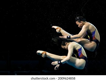 GOLD COAST, AUSTRALIA - APRIL 11, 2018: Jun Hoong Cheong and Pandelela Rinong Pamg of Malaysia compete in the Women's Synchronised 10m Platform Diving Final of the Gold Coast 2018 Commonwealth Games.