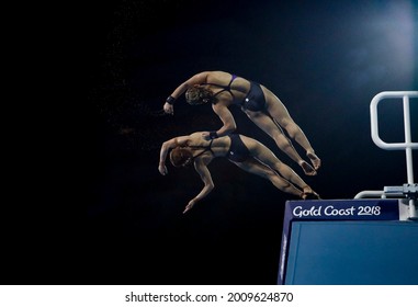 GOLD COAST, AUSTRALIA - APRIL 11, 2018: Mun Yee Leong and Nur Dhabitah Sabri of Malaysia compete in the Women's Synchronised 10m Platform Diving Final of the Gold Coast 2018 Commonwealth Games.