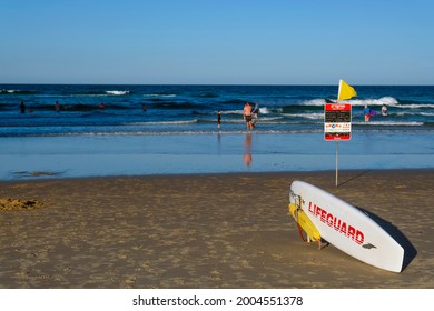 GOLD COAST, AUSTRALIA - APRIL 16, 2018: Lifeguard's surfboard at Main Beach Surfers Paradise. One of the main tourist destinations at Gold Coast.