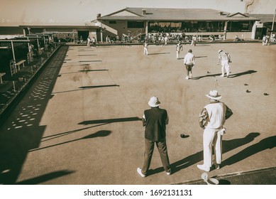 GOLD COAST, AUSTRALIA - AUGUST 2010: Elderly People Play Bowls On The Beach On A Sunny Day.