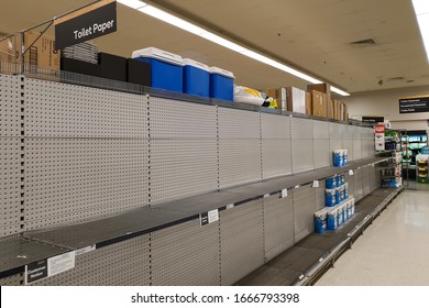 Gold Coast, Australia - March 8, 2020: Coles supermarket empty toilet paper shelves amid coronavirus fears, shoppers panic buying and stockpiling toilet paper as Australia prepares for a pandemic.